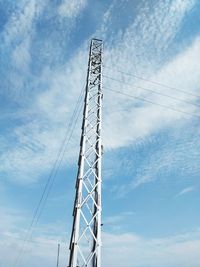 Low angle view of telephone pole against sky