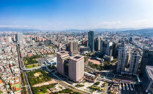 High angle view of modern buildings in city against sky