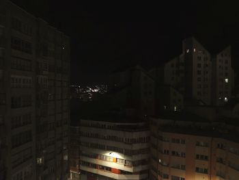 Buildings in city at night