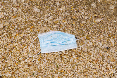 High angle view of paper on beach