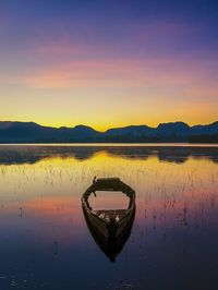 Scenic view of lake against sky during sunset