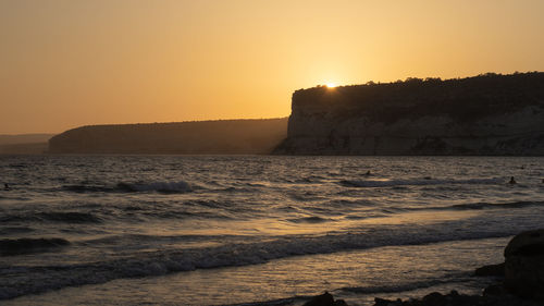 Scenic view of sea against sky during sunset