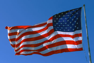 American usa flag on a flagpole waving wind. usa flag waving united states of america flag flying.