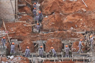 Group of people working on rock
