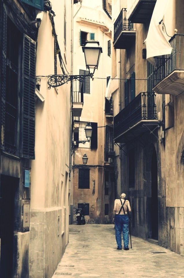 architecture, building exterior, built structure, men, walking, rear view, lifestyles, person, street, city, full length, building, leisure activity, city life, the way forward, residential building, standing