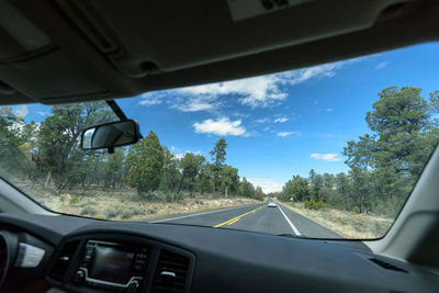 Cropped image of car on road