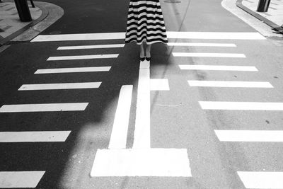 High angle view of arrow sign on road