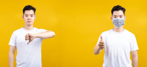 Portrait of friends standing against yellow background