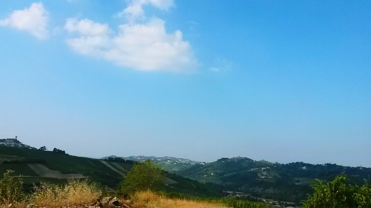 tranquil scene, tranquility, blue, mountain, landscape, scenics, beauty in nature, sky, nature, mountain range, copy space, non-urban scene, grass, idyllic, remote, horizon over land, clear sky, day, countryside, outdoors