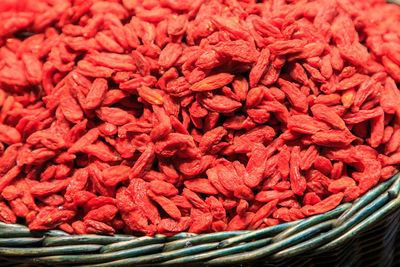 Pile of goji berries in wicker basket