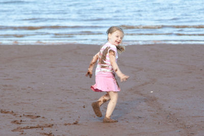 Full length of girl on beach