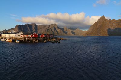 Panoramic view of sea and mountains against sky