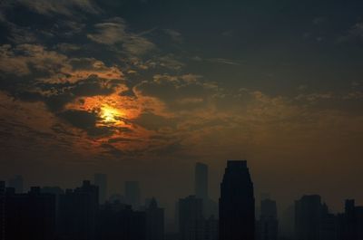 Silhouette of city at sunset