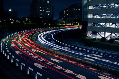 High angle view of light trails on highway at night