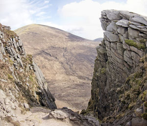 Rock formations on mountain against sky