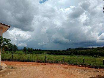 Scenic view of agricultural field against sky