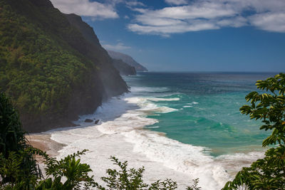 Scenic view of hanakapiai beach seen from kalalau hiking trail on kauai, hawaii, usa against sky