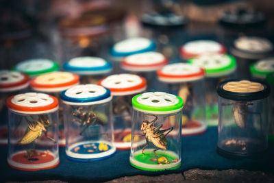 Close-up of multi colored candles on table