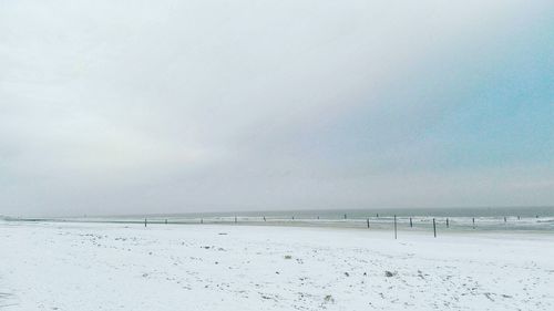 Scenic view of sea against sky during winter