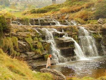 Man working at waterfall