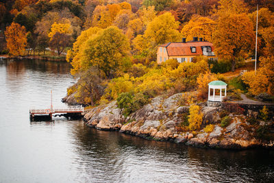 House by lake during autumn
