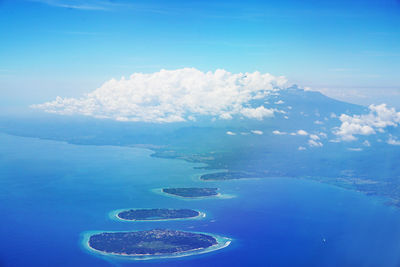 Aerial view of sea and island against sky