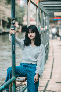 Portrait of young woman standing outdoors