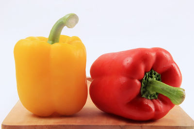 Close-up of bell peppers against white background