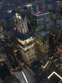 High angle view of illuminated cityscape at night