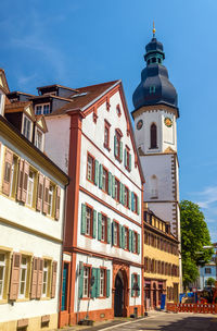 Low angle view of buildings against blue sky