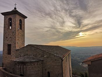Historic building against sky during sunset