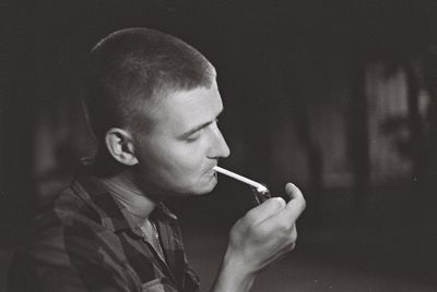 Portrait of man smoking cigarette