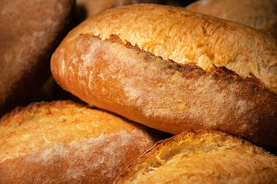 Close-up of sourdough bread. freshly baked bread with a golden crust on the wooden shelves 