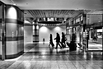 People in corridor of building