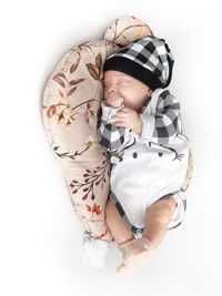 Full length of boy with toy against white background