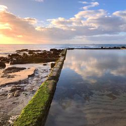 Scenic view of sea against sky during sunset