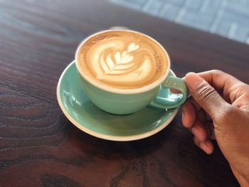 High angle view of coffee cup on table