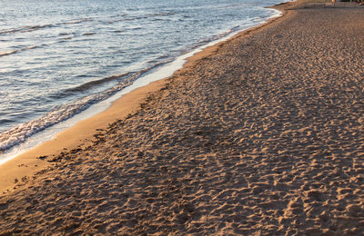 High angle view of surf on beach