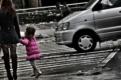 Blurred motion of people on road