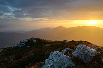 Scenic view of mountains against sky during sunset