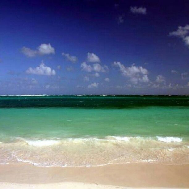 water, sea, beach, sky, tranquil scene, scenics, beauty in nature, tranquility, shore, sand, blue, nature, wave, cloud - sky, idyllic, surf, coastline, horizon over water, cloud, day