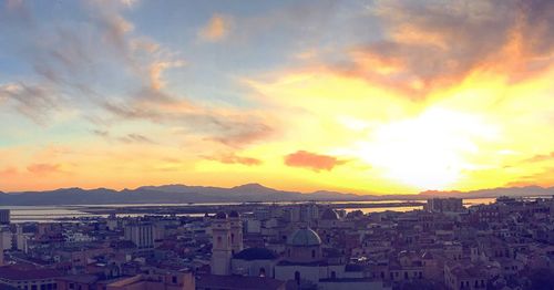 Cityscape against sky during sunset