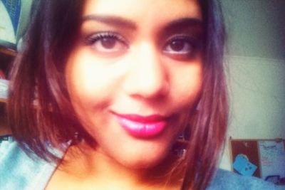 Close-up portrait of a smiling young woman