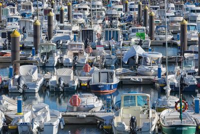 High angle view of boats moored at harbor