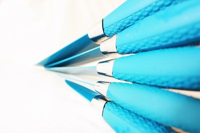 Close-up of pen over white background