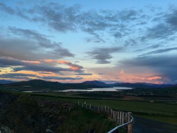 Scenic view of landscape against cloudy sky