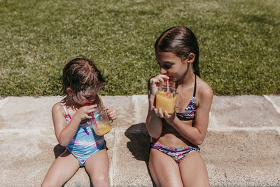 Women sitting in a drinking glass