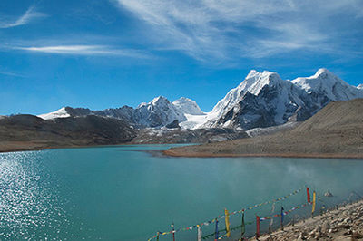 Scenic view of snowcapped mountain against cloudy sky
