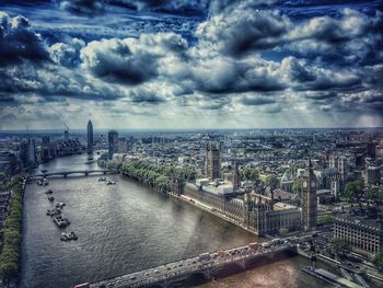 High angle view of cityscape against cloudy sky