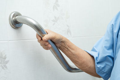 Midsection of man working in kitchen